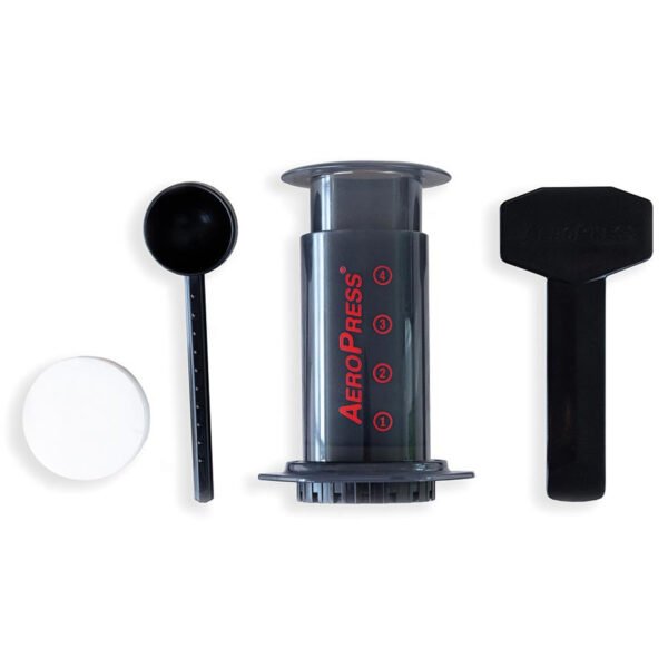 AeroPress kit with paper filters, measuring spoon, and stirrer.